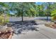 Street view of lush landscaping and mature trees at 6918 Frog Pocket Pl, Tampa, FL 33616