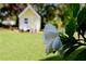 Picturesque backyard featuring a lush lawn and a charming playhouse at 7229 Northbridge Blvd, Tampa, FL 33615