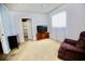 Cozy bedroom features carpet, closet and television at 7229 Northbridge Blvd, Tampa, FL 33615