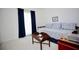 Cozy bedroom with daybed, dark blue curtains and a charming side table; neutral carpet at 7229 Northbridge Blvd, Tampa, FL 33615