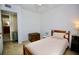 Bedroom featuring a cozy bed, trunk, neutral walls and carpet at 7229 Northbridge Blvd, Tampa, FL 33615
