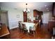 Dining room with hardwood floors, a chandelier, and a table with six chairs at 7229 Northbridge Blvd, Tampa, FL 33615