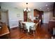 Dining room featuring a table with six chairs and hardwood floors at 7229 Northbridge Blvd, Tampa, FL 33615
