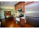 Modern kitchen with stainless steel appliances, granite countertops and views into the dining room at 7229 Northbridge Blvd, Tampa, FL 33615