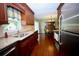Spacious kitchen features granite countertops, stainless steel appliances, and rich wood cabinetry at 7229 Northbridge Blvd, Tampa, FL 33615