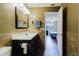 Bathroom features a modern vanity with tile backsplash and updated fixtures at 7402 America Way, New Port Richey, FL 34654