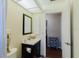 Bright bathroom with a sleek vanity, mirror, and modern fixtures at 7402 America Way, New Port Richey, FL 34654