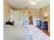 Bedroom with hardwood floors, ceiling fan, access to a bathroom, desk area and closet at 7402 America Way, New Port Richey, FL 34654