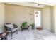 Inviting front porch with seating area and decorative accents at 7402 America Way, New Port Richey, FL 34654