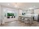 Eat-in kitchen with a large window, pendant lights, and lots of counter space at 7402 America Way, New Port Richey, FL 34654