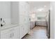 Spacious kitchen design with white cabinetry, modern appliances, and ample storage, perfect for culinary enthusiasts at 7402 America Way, New Port Richey, FL 34654