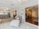 An open concept living room with a kitchen, seating area, and tile and wood flooring at 7402 America Way, New Port Richey, FL 34654