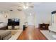 Open-concept living room with hardwood floors and lots of natural light at 7402 America Way, New Port Richey, FL 34654