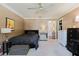 Cozy bedroom with neutral walls, plush carpet, and a dresser at 7402 America Way, New Port Richey, FL 34654