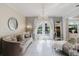 Sitting Room with a chandelier, elegant decor, and access to the outside at 7402 America Way, New Port Richey, FL 34654