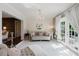 Sitting Room with a chandelier, elegant decor, and access to the outside at 7402 America Way, New Port Richey, FL 34654