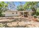 Expansive backyard featuring brick patio with a covered area at 7603 N 53Rd St, Tampa, FL 33617