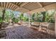 Lush backyard with brick patio, fountain and covered pergola provides privacy at 7603 N 53Rd St, Tampa, FL 33617