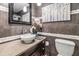 Well-lit modern bathroom with a vessel sink and a decorative backsplash at 7603 N 53Rd St, Tampa, FL 33617