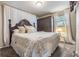 Comfortable bedroom featuring soft carpet, a window, and closet at 7603 N 53Rd St, Tampa, FL 33617