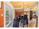 Breakfast nook with a view to the backyard, a small dining table, and comfortable seating at 7603 N 53Rd St, Tampa, FL 33617