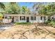 Charming one-story home with a covered front porch and beautiful landscaping at 7603 N 53Rd St, Tampa, FL 33617