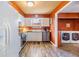 Bright kitchen with ample counter space, white cabinets and stainless appliances at 7603 N 53Rd St, Tampa, FL 33617
