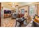 Charming living room with wood-look floors, comfortable seating, and abundant natural light at 7603 N 53Rd St, Tampa, FL 33617