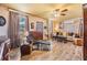 Inviting living room featuring wood-look flooring, lots of natural light and a ceiling fan at 7603 N 53Rd St, Tampa, FL 33617