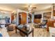 Cozy living room with wood floors, ceiling fan and vintage furnishings at 7603 N 53Rd St, Tampa, FL 33617