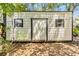 Exterior view of outbuilding with neutral siding and black trim at 7603 N 53Rd St, Tampa, FL 33617