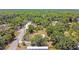 Aerial view of a neighborhood with a mobile home surrounded by trees and foliage at 850 Center Ave, Brandon, FL 33511