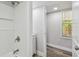 Bathroom featuring tiled shower and modern vanity with white cabinets at 850 Center Ave, Brandon, FL 33511