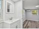 Bathroom with modern vanity and an adjoining room at 850 Center Ave, Brandon, FL 33511