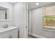 Bathroom with modern vanity, window and open doorway at 850 Center Ave, Brandon, FL 33511