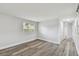 Large, light-filled bedroom features modern wood-look flooring and a closet at 850 Center Ave, Brandon, FL 33511
