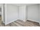 Bedroom with wood-look floors, closet and neutral color palette at 850 Center Ave, Brandon, FL 33511