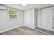 A bedroom features a neutral color palette, closet and window at 850 Center Ave, Brandon, FL 33511