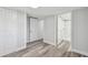 Bright bedroom with wood-look flooring, closet and ensuite bathroom at 850 Center Ave, Brandon, FL 33511