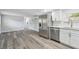 Open kitchen features stainless steel appliances, new flooring, and ample cabinet space at 850 Center Ave, Brandon, FL 33511
