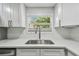 Bright kitchen features a stainless steel sink, modern faucet and bright white countertops at 850 Center Ave, Brandon, FL 33511