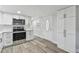 Updated kitchen features stainless steel appliances, new flooring, and ample cabinet space at 850 Center Ave, Brandon, FL 33511