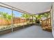 A screened-in porch offers views of the fenced-in backyard at 850 Center Ave, Brandon, FL 33511