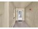 Hallway leads to unit entrance, showcasing the building's interior and access point at 90 S Highland Ave # 201, Tarpon Springs, FL 34689