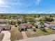 From above, a home is seen with its lawn and landscaping in a well established neighborhood at 9010 Bonnet Way, Weeki Wachee, FL 34613
