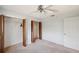 Bedroom featuring open, louvered closets and neutral carpet at 9010 Bonnet Way, Weeki Wachee, FL 34613