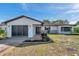 Charming single-story home with a well-manicured lawn and inviting front entrance at 9010 Bonnet Way, Weeki Wachee, FL 34613