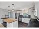 Recently renovated kitchen showcases stainless steel appliances, a center island, and modern fixtures at 9010 Bonnet Way, Weeki Wachee, FL 34613