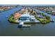 Waterfront home featuring a private dock, backyard swimming pool, and manicured landscaping at 935 Chipaway Dr, Apollo Beach, FL 33572