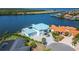 Waterfront home boasts private dock, lush landscaping, and expansive water views at 935 Chipaway Dr, Apollo Beach, FL 33572